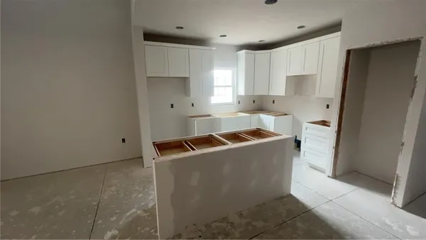 a kitchen that has a sink and a refrigerator