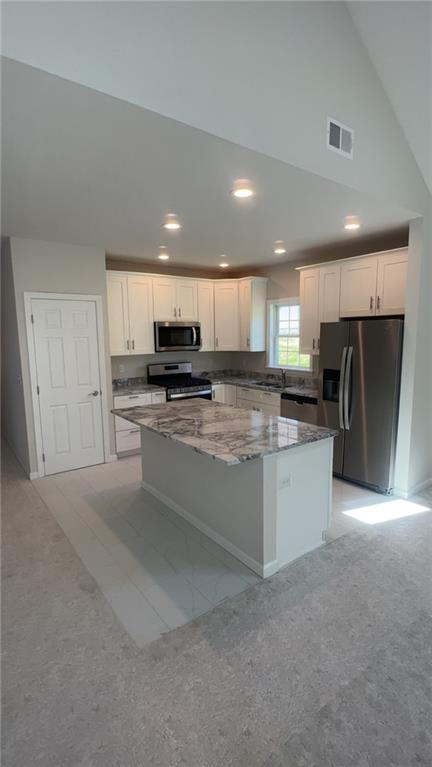 328 River Rdg Court, Unit 47B Baden, PA 15005 - Photo 8 of 20 a kitchen with stainless steel appliances granite countertop a refrigerator sink and cabinets