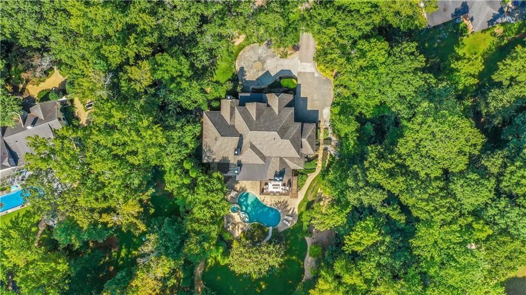 5265 Peachtree Dunwoody Road Sandy Springs, GA 30342 - Photo 106 of 122 an aerial view of a house with a yard and garden