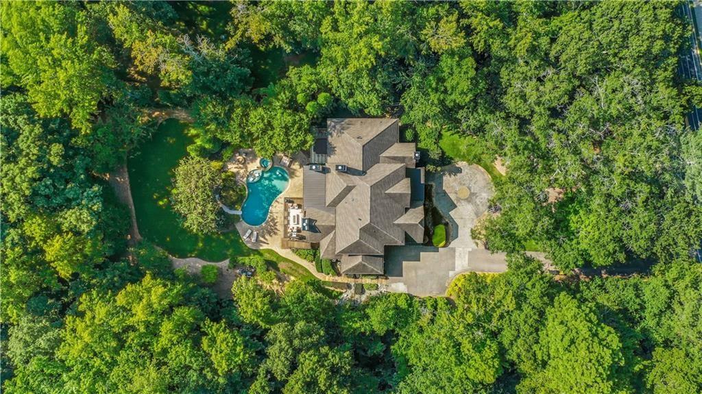 5265 Peachtree Dunwoody Road Sandy Springs, GA 30342 - Photo 107 of 122 an aerial view of a house with a yard