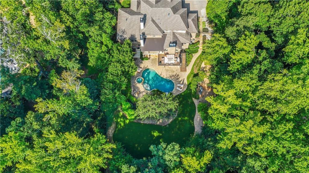 5265 Peachtree Dunwoody Road Sandy Springs, GA 30342 - Photo 108 of 122 an aerial view of a house with a yard