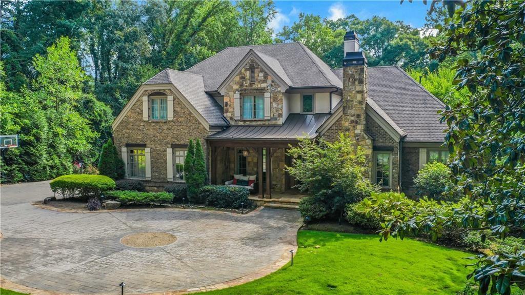 5265 Peachtree Dunwoody Road Sandy Springs, GA 30342 - Photo 112 of 122 a front view of a house with a yard