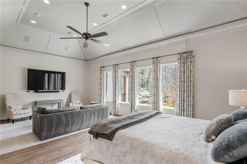 5265 Peachtree Dunwoody Road Sandy Springs, GA 30342 - Photo 13 of 122 a bedroom with a bed and a flat screen tv