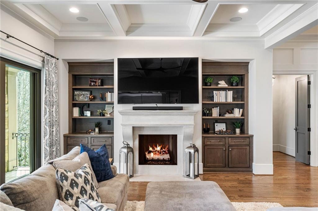 5265 Peachtree Dunwoody Road Sandy Springs, GA 30342 - Photo 18 of 122 a living room with furniture and a fireplace
