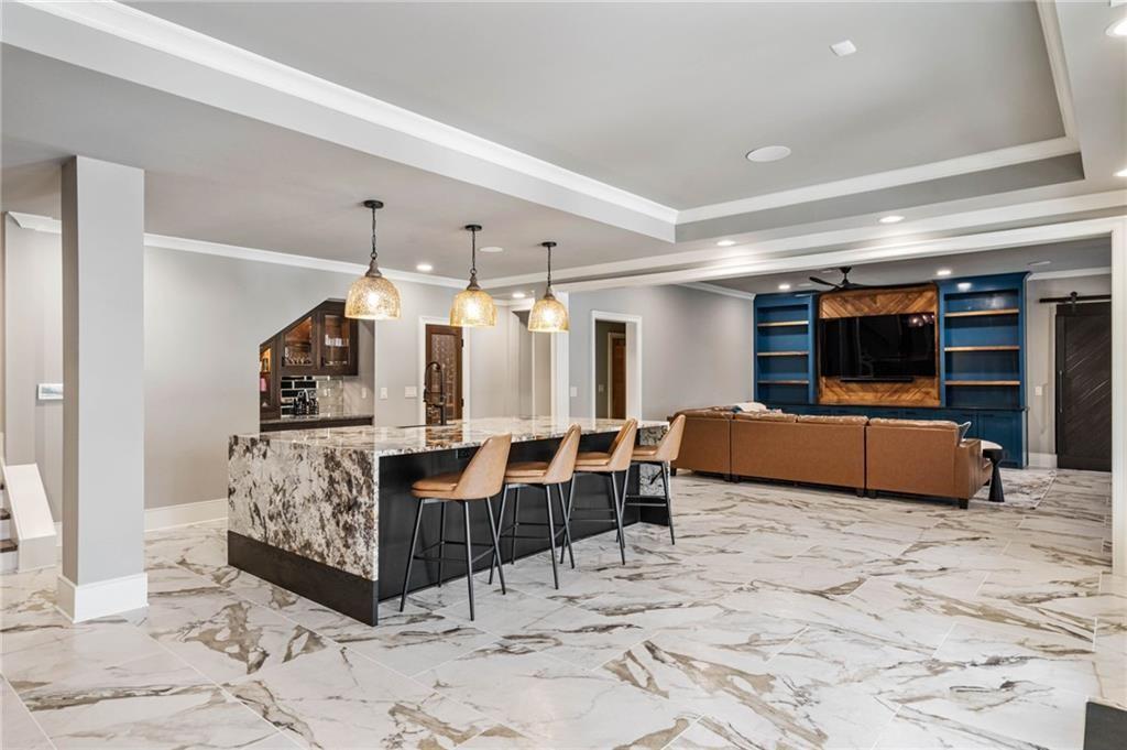 5265 Peachtree Dunwoody Road Sandy Springs, GA 30342 - Photo 30 of 122 a view of a livingroom with furniture and a flat screen tv