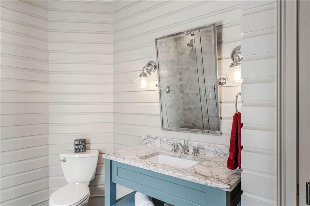 5265 Peachtree Dunwoody Road Sandy Springs, GA 30342 - Photo 48 of 122 a bathroom with a sink and a mirror