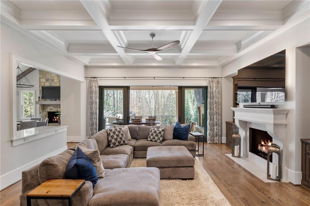 5265 Peachtree Dunwoody Road Sandy Springs, GA 30342 - Photo 5 of 122 a living room with furniture fireplace and flat screen tv