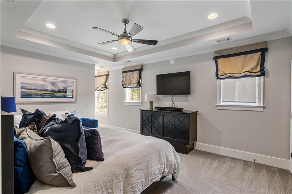 5265 Peachtree Dunwoody Road Sandy Springs, GA 30342 - Photo 56 of 122 a bedroom with a bed and a flat screen tv