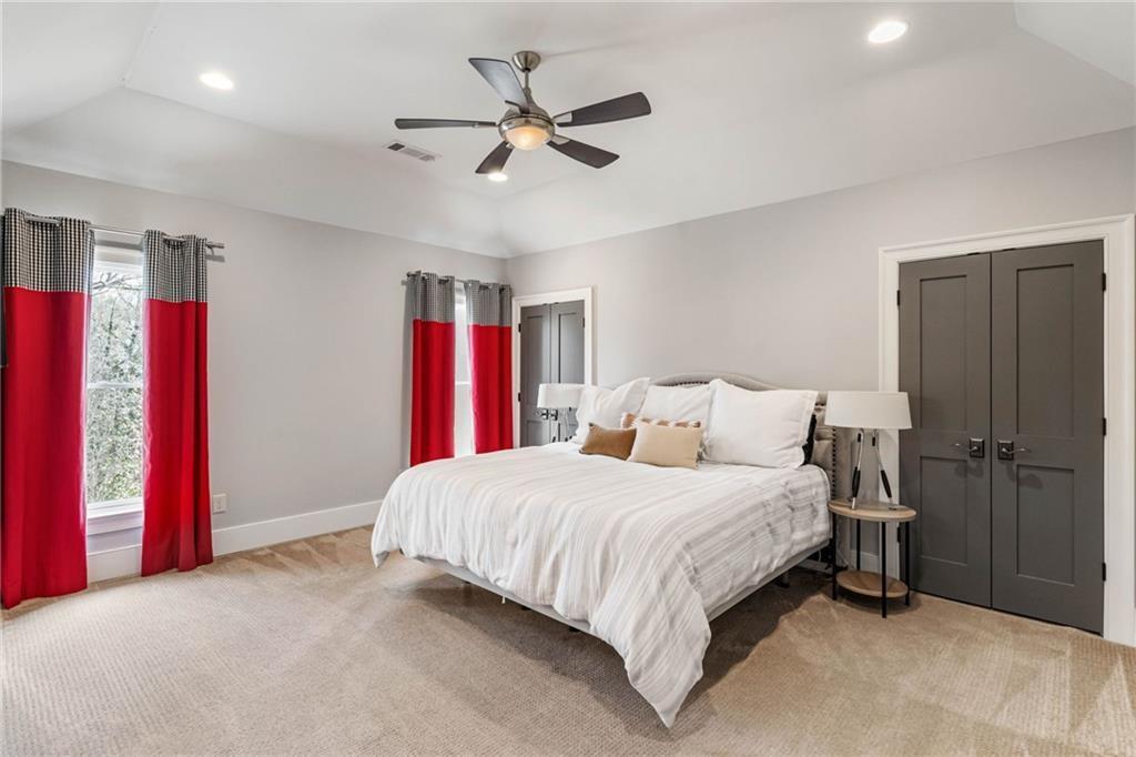 5265 Peachtree Dunwoody Road Sandy Springs, GA 30342 - Photo 58 of 122 a bedroom with a bed and a ceiling fan