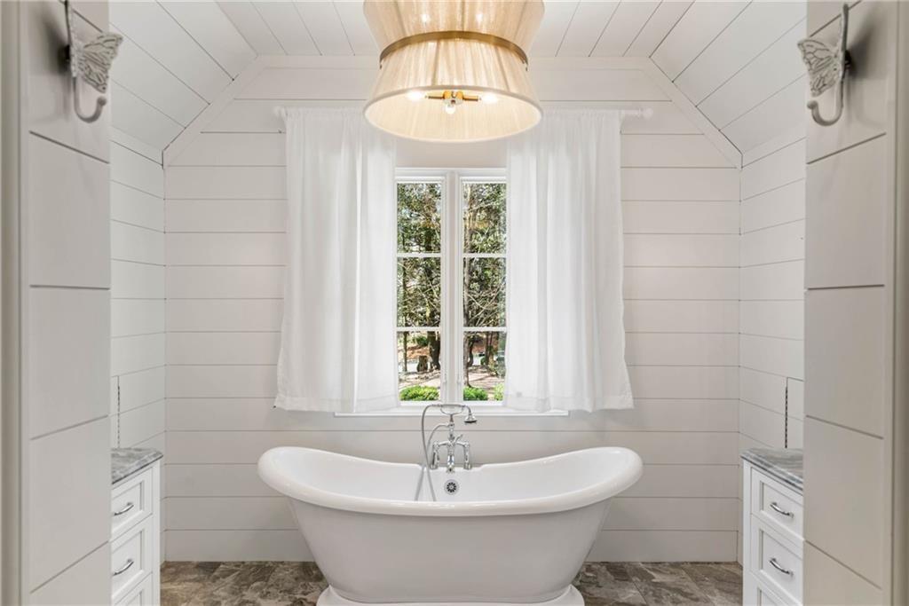 5265 Peachtree Dunwoody Road Sandy Springs, GA 30342 - Photo 66 of 122 a bathroom with a sink and a window