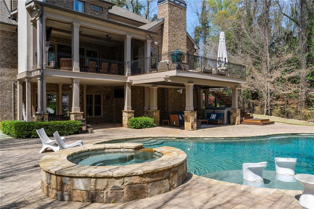 5265 Peachtree Dunwoody Road Sandy Springs, GA 30342 - Photo 73 of 122 a house view with a sitting space and garden space