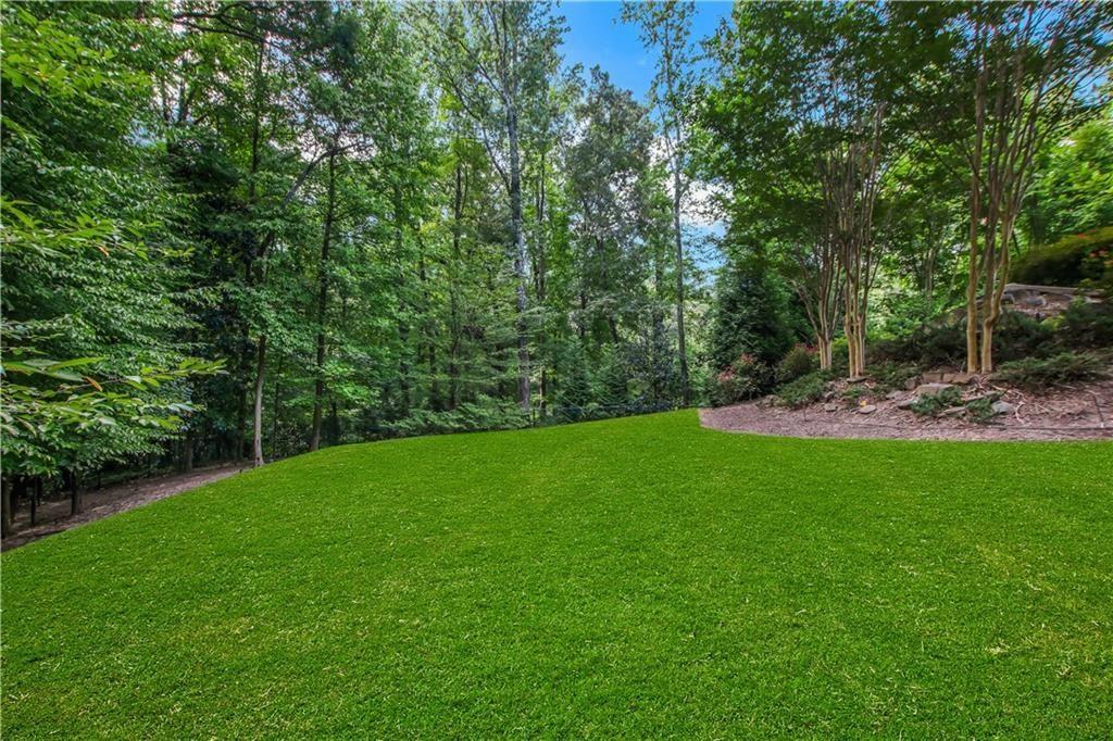 5265 Peachtree Dunwoody Road Sandy Springs, GA 30342 - Photo 80 of 122 a view of green field with trees in the background
