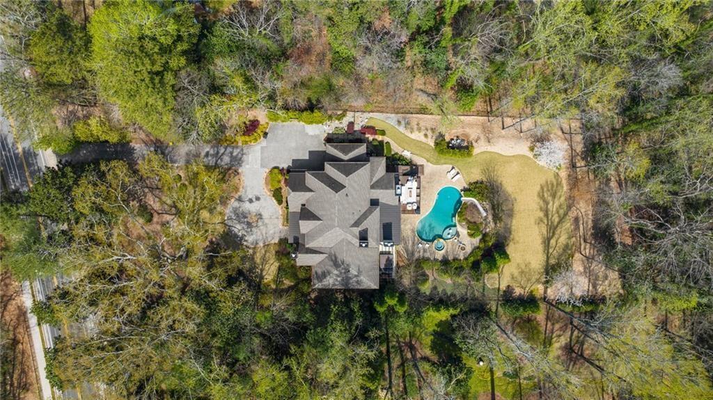 5265 Peachtree Dunwoody Road Sandy Springs, GA 30342 - Photo 84 of 122 an aerial view of residential house with outdoor space and trees all around