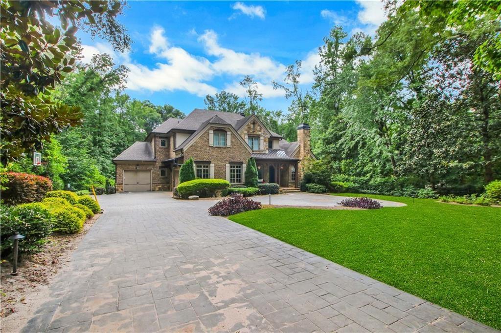 5265 Peachtree Dunwoody Road Sandy Springs, GA 30342 - Photo 87 of 122 a front view of a house with garden