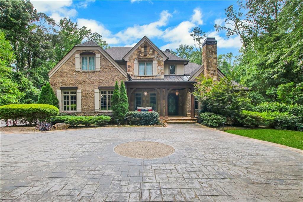 5265 Peachtree Dunwoody Road Sandy Springs, GA 30342 - Photo 90 of 122 a front view of a house with garden