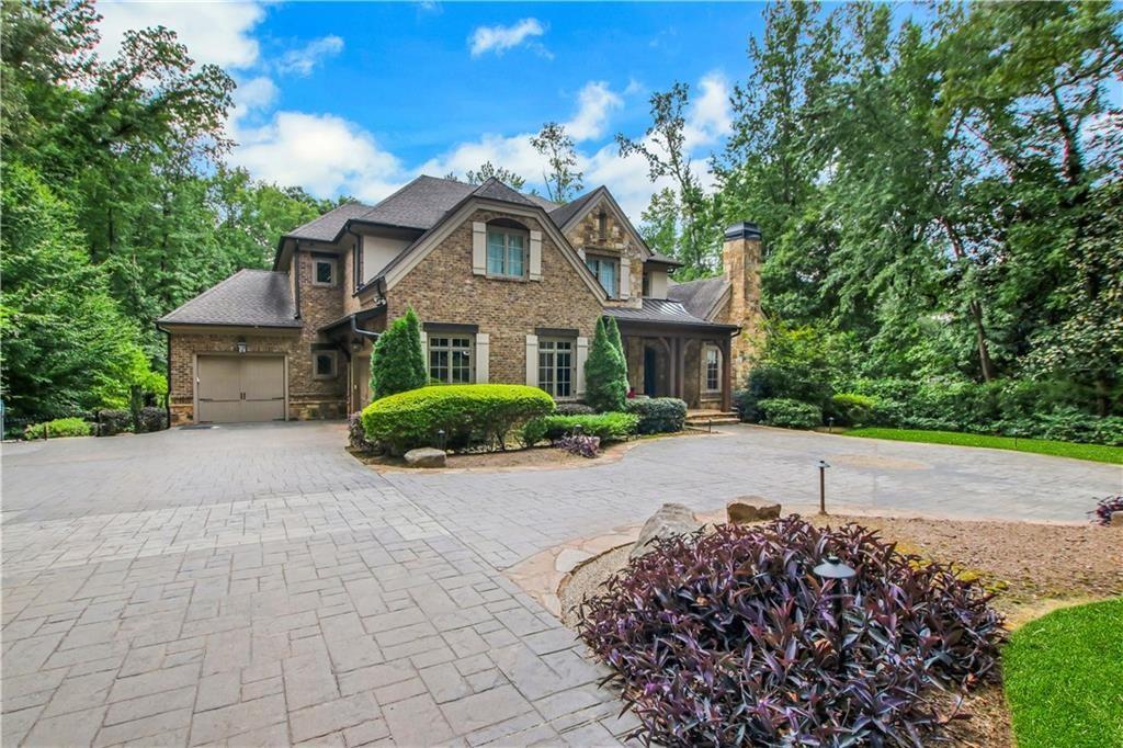 5265 Peachtree Dunwoody Road Sandy Springs, GA 30342 - Photo 91 of 122 a front view of a house with a garden