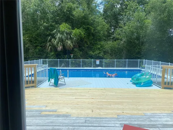 a view of a swimming pool with a patio