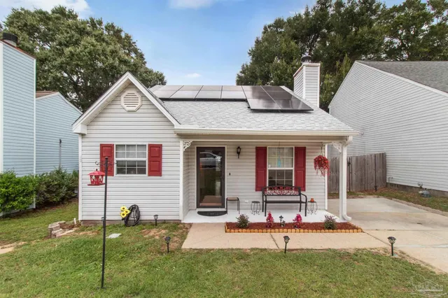 a front view of a house with garden