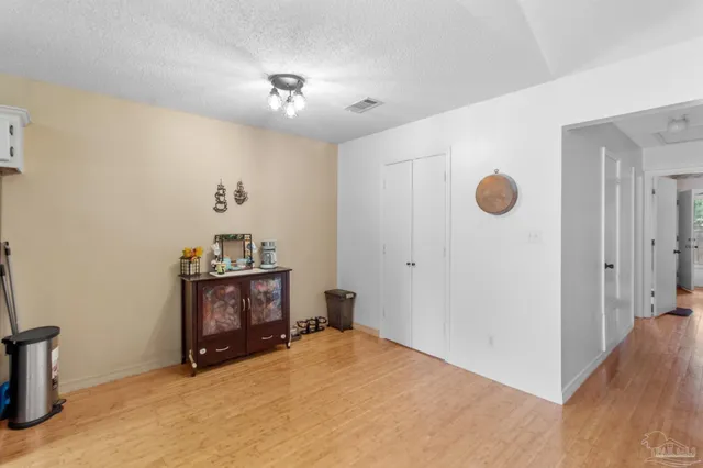 a room with furniture and mirror