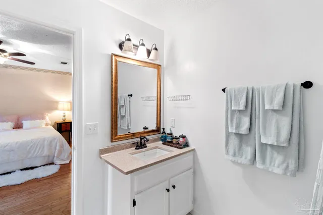 a en suite bathroom with a sink and a mirror