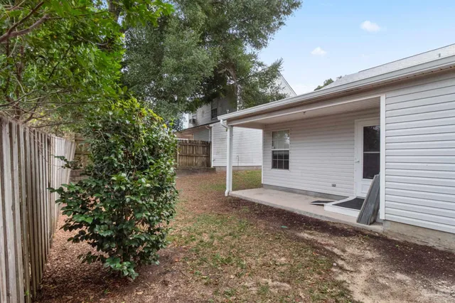 a view of a house with a yard and garage