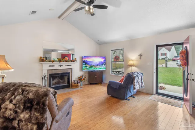 a living room with furniture and a fireplace