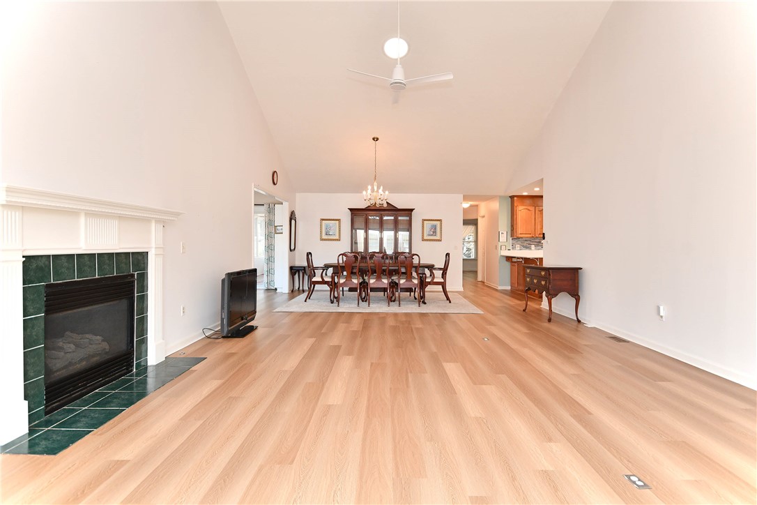 103 Baldwin Place Easley, SC 29642 - Photo 14 of 42 This expansive great room seamlessly blends living and dining, anchored by a fireplace and vaulted ceilings.