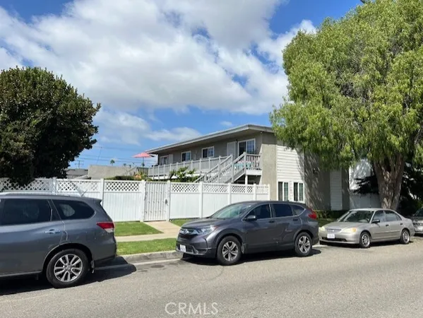 a view of a car parked in front of a house
