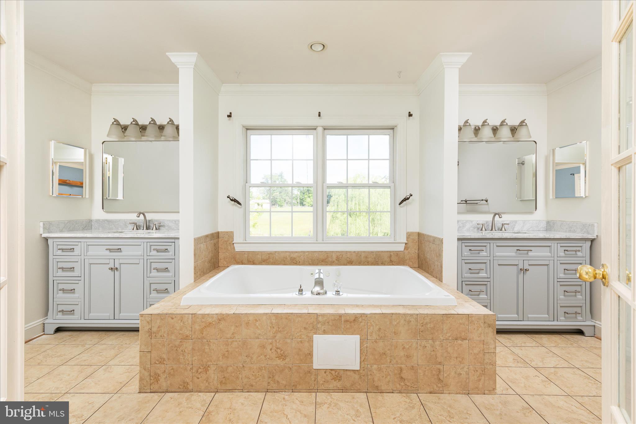 1200 Salem Church Road Stephens City, VA 22655 - Photo 36 of 69 a spacious bathroom with a granite countertop sink a mirror a bathtub and window