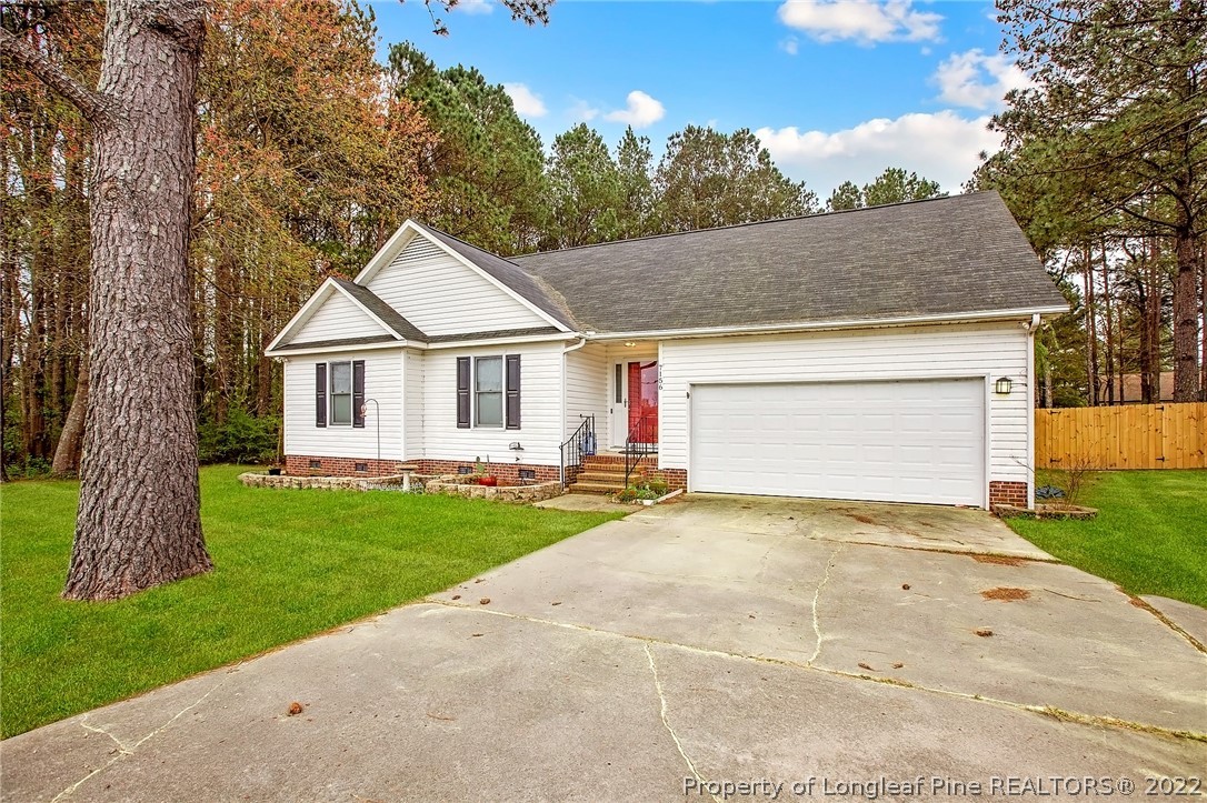 7156 Rockfish Road Raeford, NC 28376 - Photo 2 of 27 a view of a house with a yard