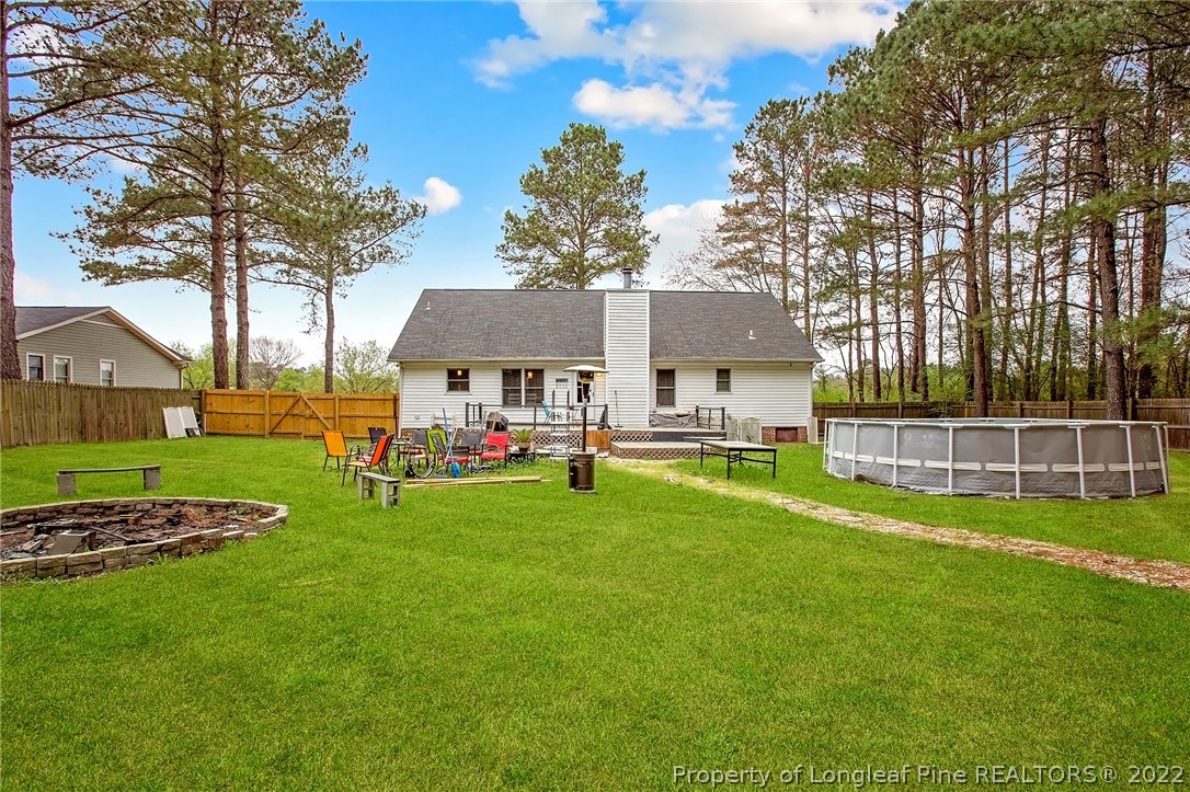 7156 Rockfish Road Raeford, NC 28376 - Photo 4 of 27 a view of a house with a big yard