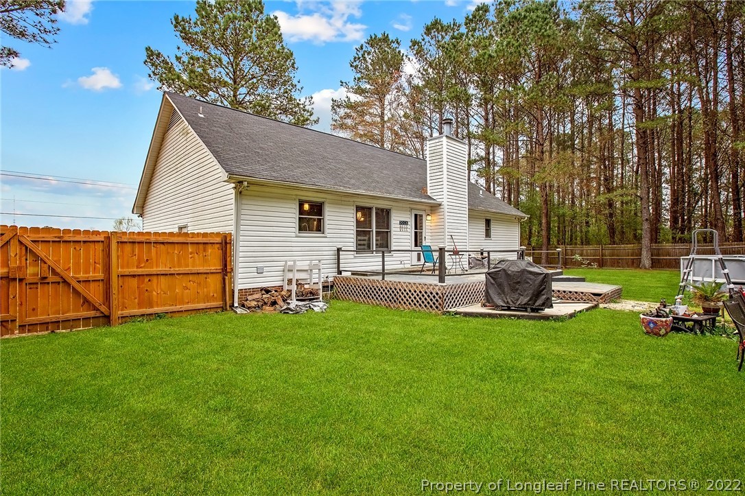 7156 Rockfish Road Raeford, NC 28376 - Photo 5 of 27 a view of a house with a yard