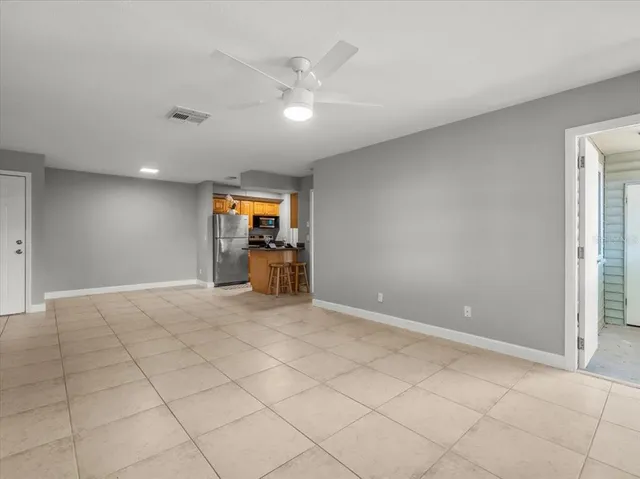a kitchen with granite countertop a stove a sink and a granite counter top