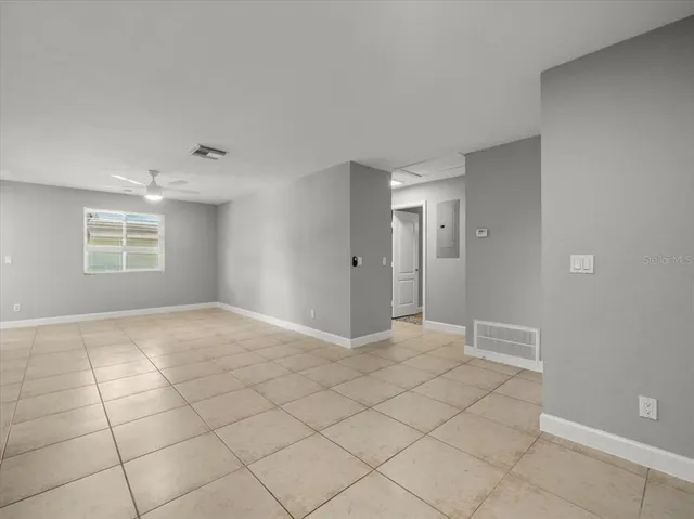 a view of an empty room with a window