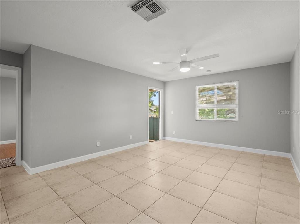 230 Thorntree Place, Unit 230 Brandon, FL 33510 - Photo 20 of 49 an empty room with windows and fan