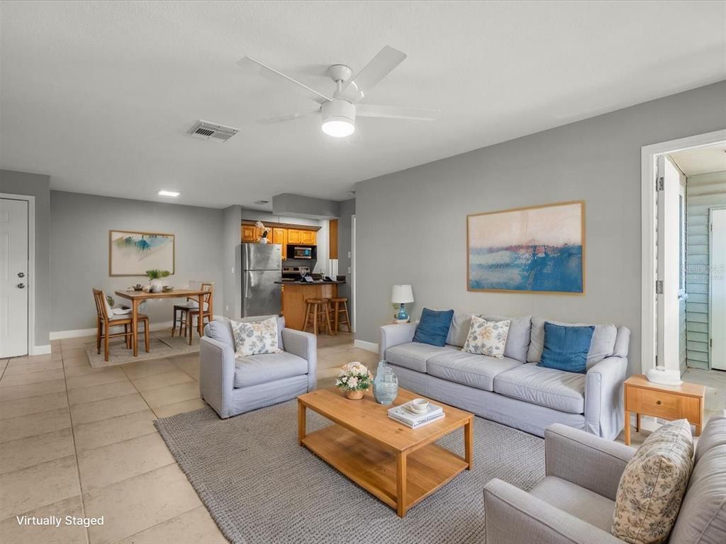 230 Thorntree Place, Unit 230 Brandon, FL 33510 - Photo 22 of 49 a living room with furniture and a flat screen tv