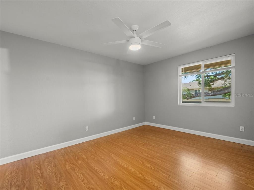 230 Thorntree Place, Unit 230 Brandon, FL 33510 - Photo 23 of 49 a view of an empty room with wooden floor and a window