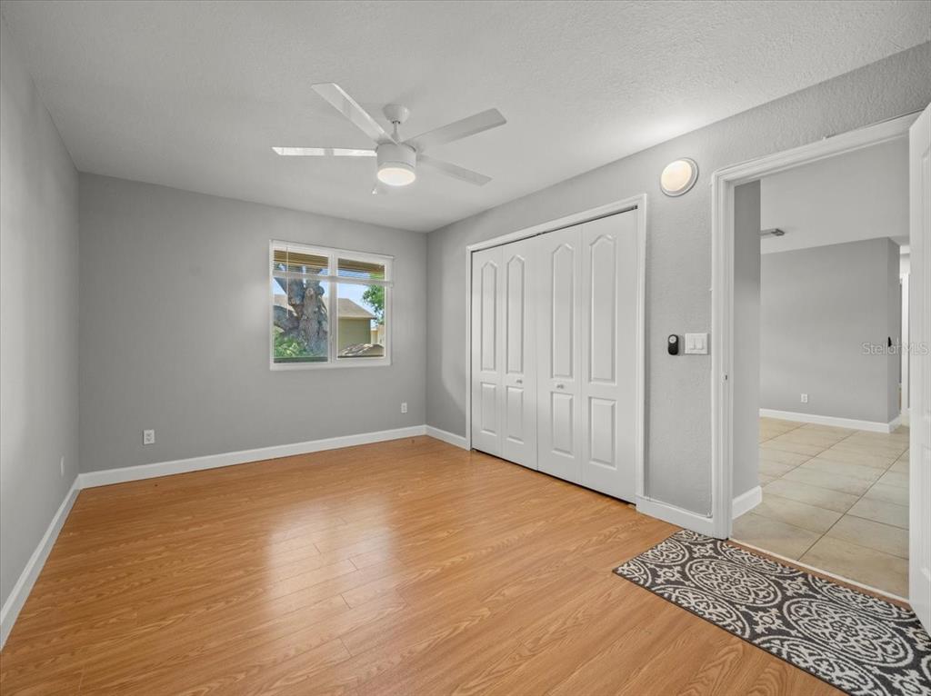 230 Thorntree Place, Unit 230 Brandon, FL 33510 - Photo 24 of 49 wooden floor in an empty room with a window