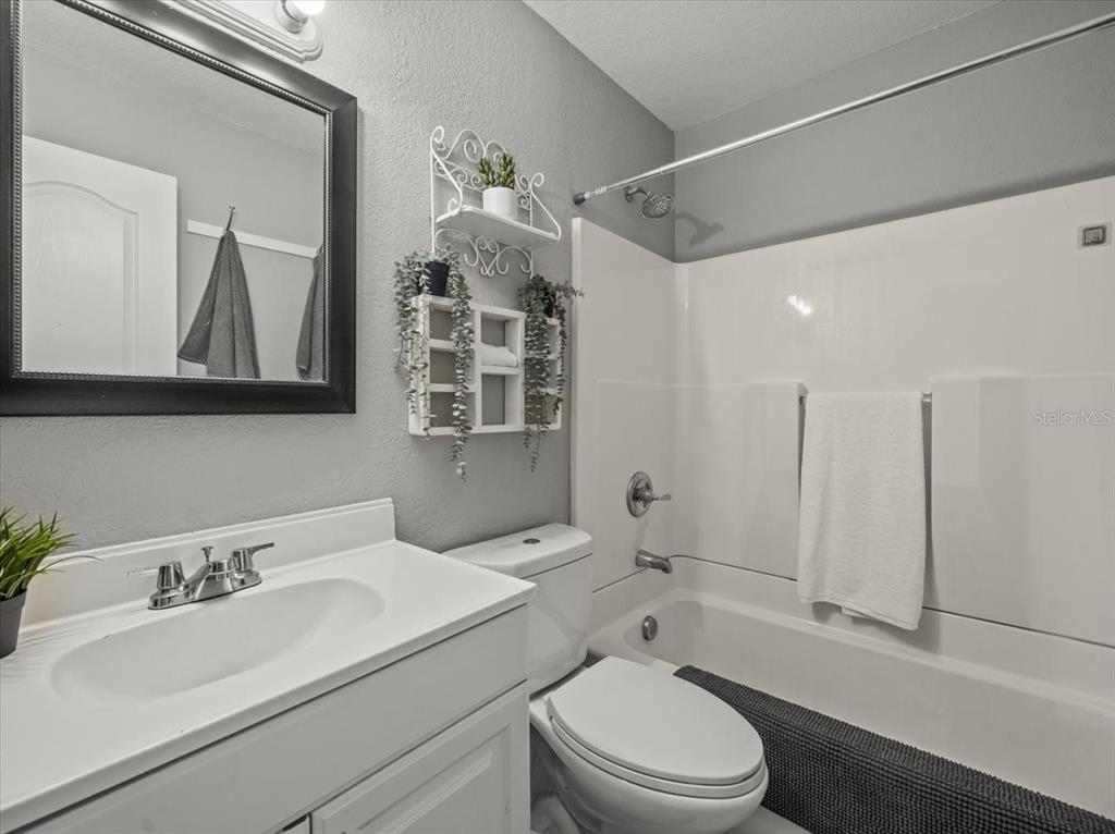 230 Thorntree Place, Unit 230 Brandon, FL 33510 - Photo 26 of 49 a bathroom with a sink a toilet and shower