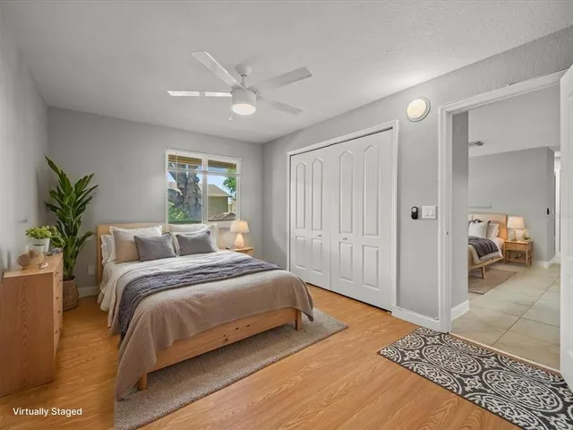 a bedroom with a large bed and a window