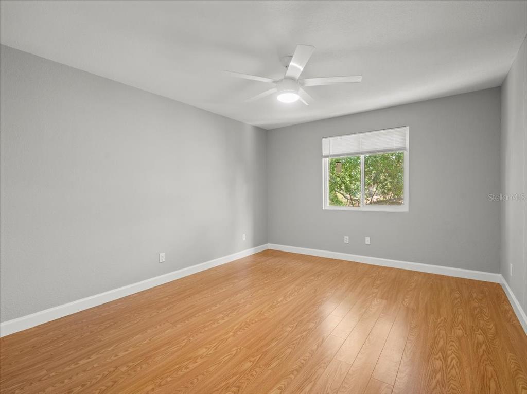 230 Thorntree Place, Unit 230 Brandon, FL 33510 - Photo 36 of 49 an empty room with wooden floor and windows