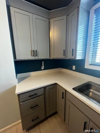 a kitchen with a cabinets and washing machine