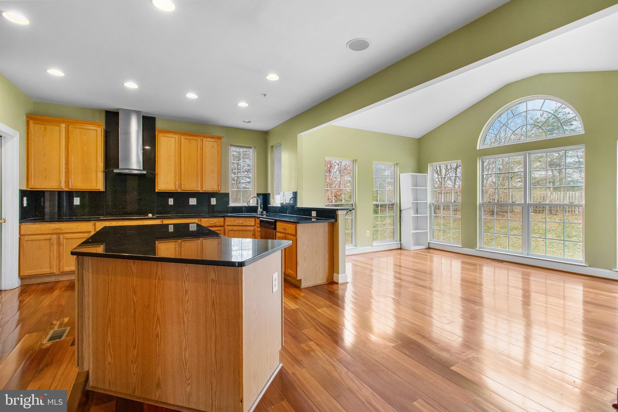 14107 Mintlaw Landing Laurel, MD 20707 - Photo 17 of 63 a kitchen with stainless steel appliances granite countertop a stove and a large window