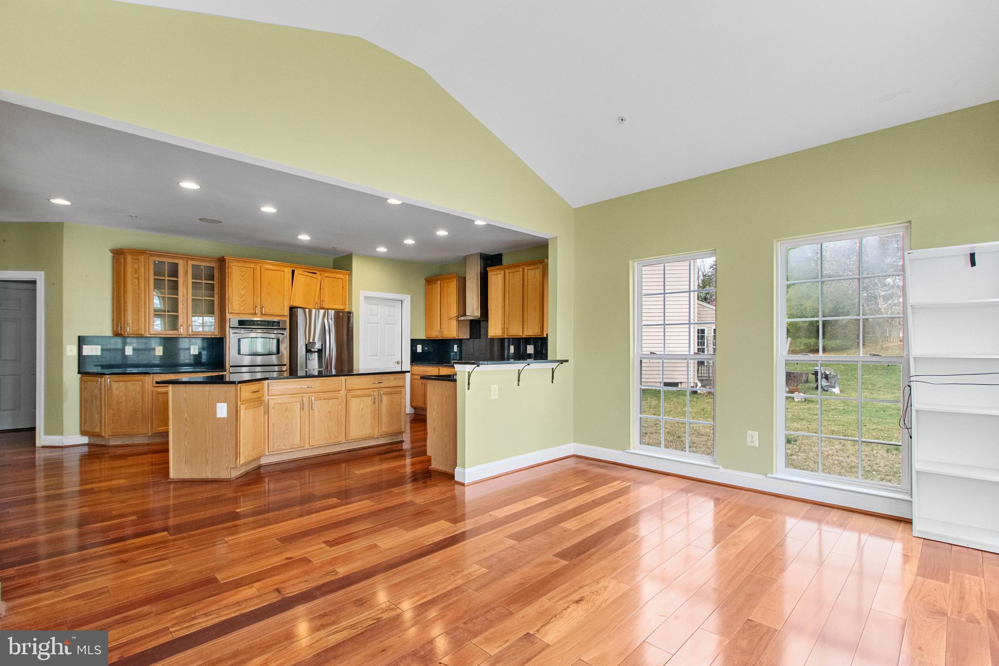 14107 Mintlaw Landing Laurel, MD 20707 - Photo 19 of 63 a large kitchen with stainless steel appliances granite countertop a large window and a counter top space