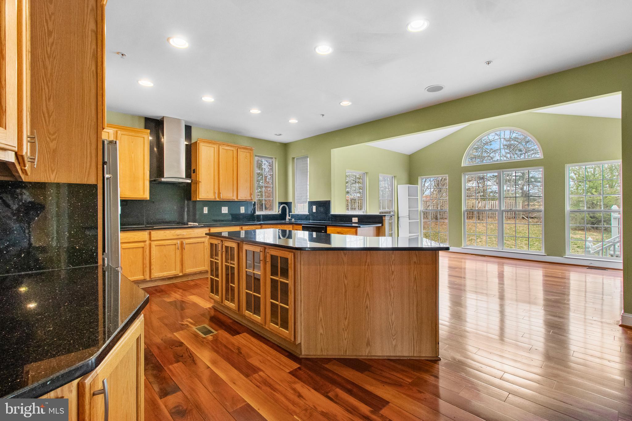 14107 Mintlaw Landing Laurel, MD 20707 - Photo 20 of 63 a large kitchen with stainless steel appliances granite countertop a large stove top oven and a refrigerator