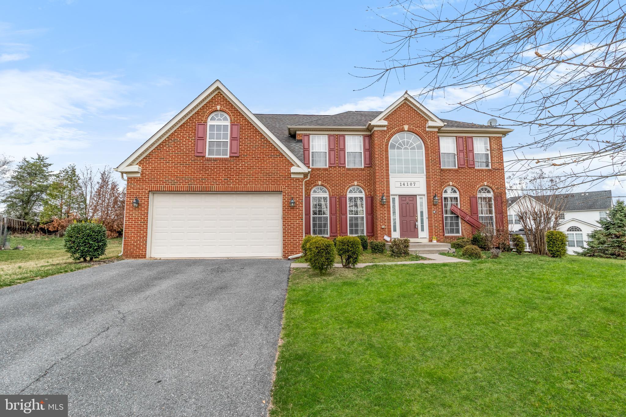 14107 Mintlaw Landing Laurel, MD 20707 - Photo 2 of 63 a front view of a house with a yard and garage