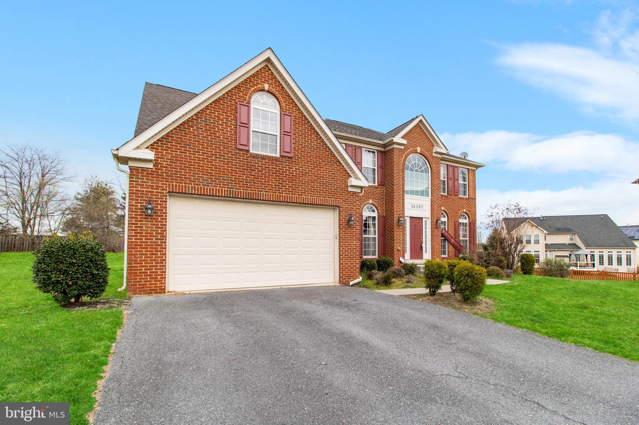 14107 Mintlaw Landing Laurel, MD 20707 - Photo 3 of 63 a front view of a house with a yard and garage