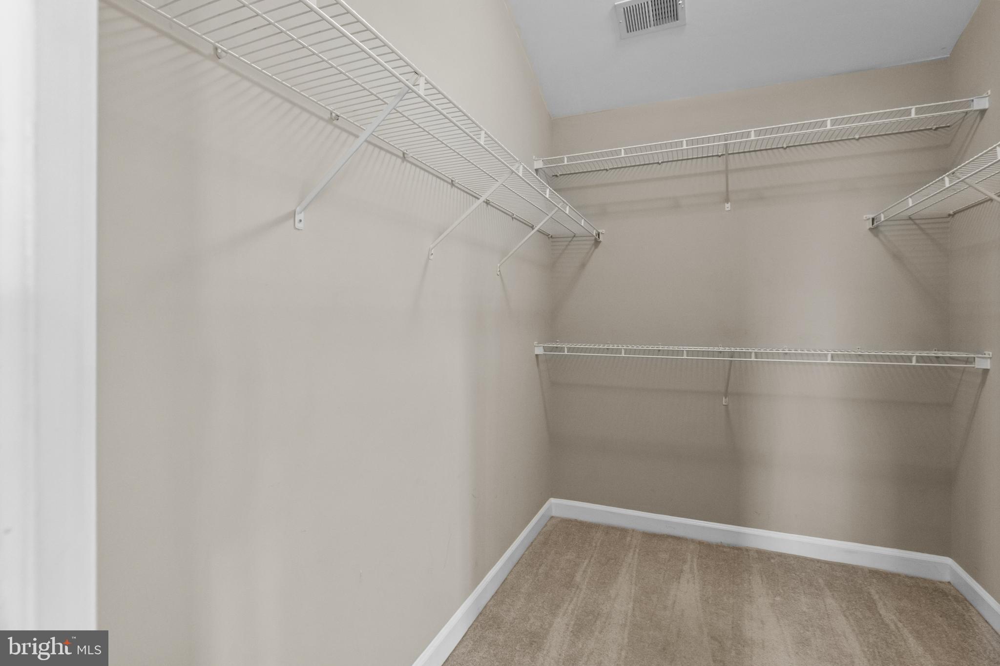 14107 Mintlaw Landing Laurel, MD 20707 - Photo 41 of 63 a view of a room with racks on the wall