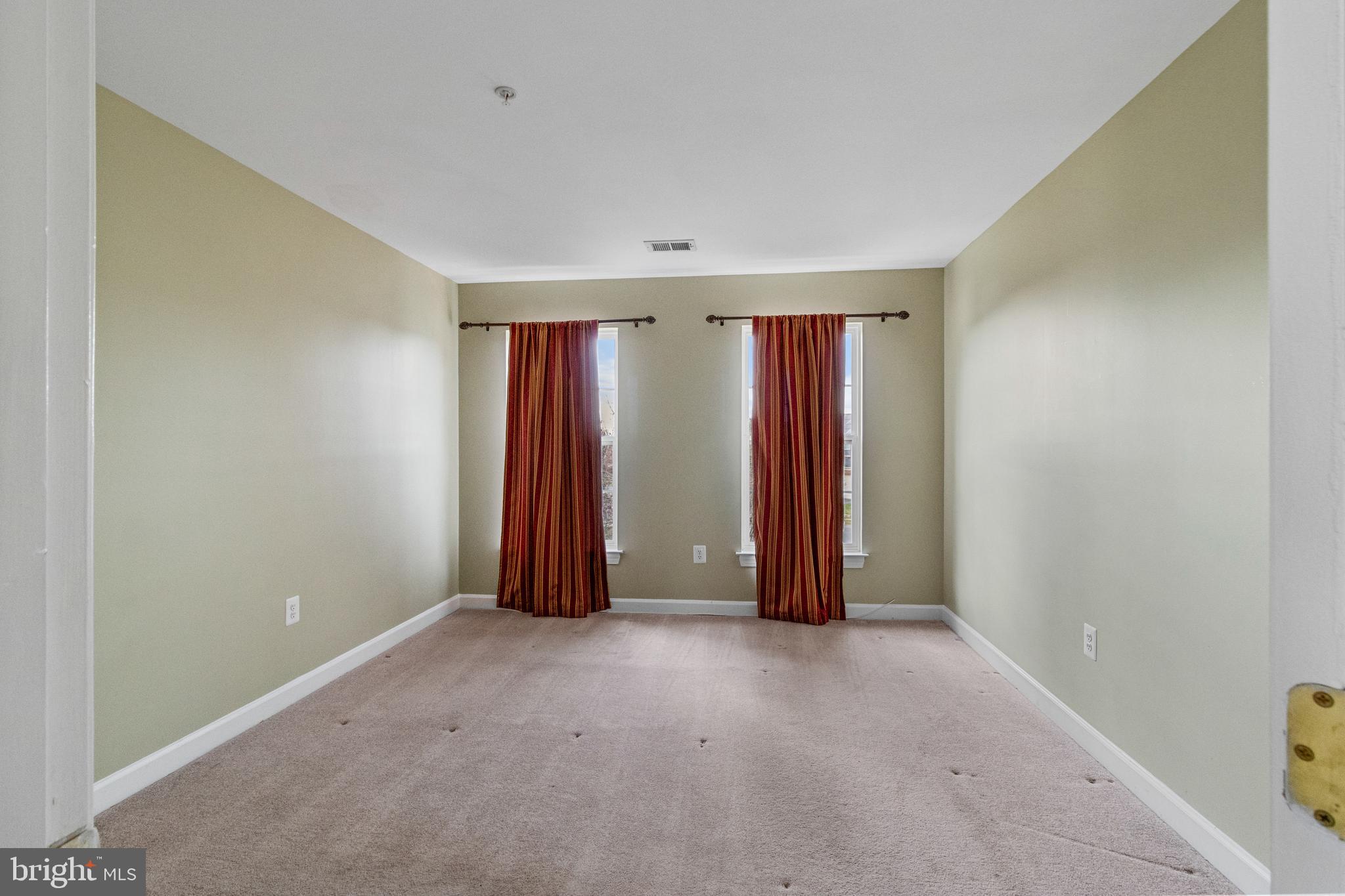 14107 Mintlaw Landing Laurel, MD 20707 - Photo 45 of 63 a view of an empty room with yellow walls