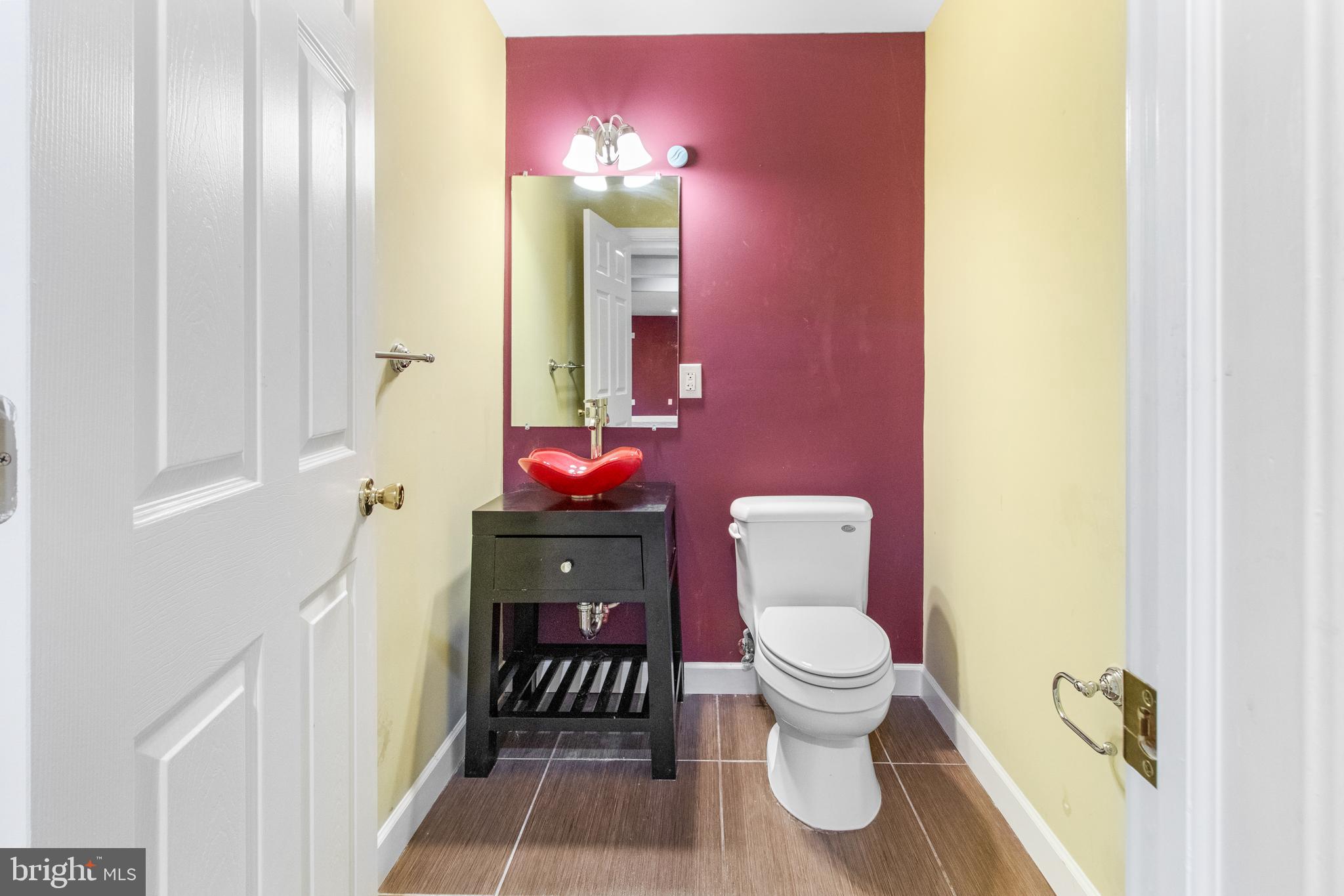 14107 Mintlaw Landing Laurel, MD 20707 - Photo 49 of 63 a bathroom with a sink and a toilet